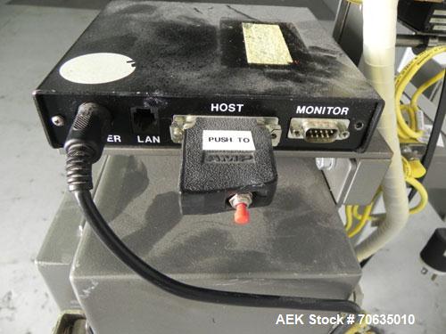 Used Minnesota Automation Model Special Reciprocating Coupon Feeder-Topserter. Capable of speeds up to 90 units per minute. Has self-contained Venturi style vacuum system. Has Allen Bradley SLC 500 P...
