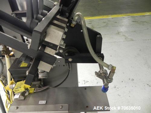 Used Minnesota Automation Model Special Reciprocating Coupon Feeder-Topserter. Capable of speeds up to 90 units per minute. Has self-contained Venturi style vacuum system. Has Allen Bradley SLC 500 P...