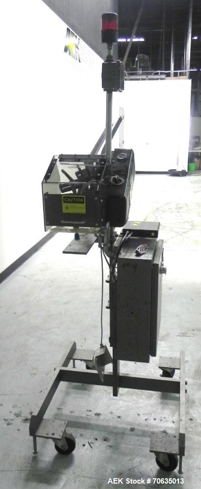 Used Minnesota Automation Model Special Reciprocating Coupon Feeder-Topserter. Capable of speeds up to 90 units per minute. Has self-contained Venturi style vacuum system. Has Allen Bradley SLC 500 P...
