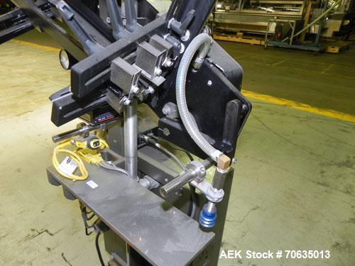 Used Minnesota Automation Model Special Reciprocating Coupon Feeder-Topserter. Capable of speeds up to 90 units per minute. Has self-contained Venturi style vacuum system. Has Allen Bradley SLC 500 P...