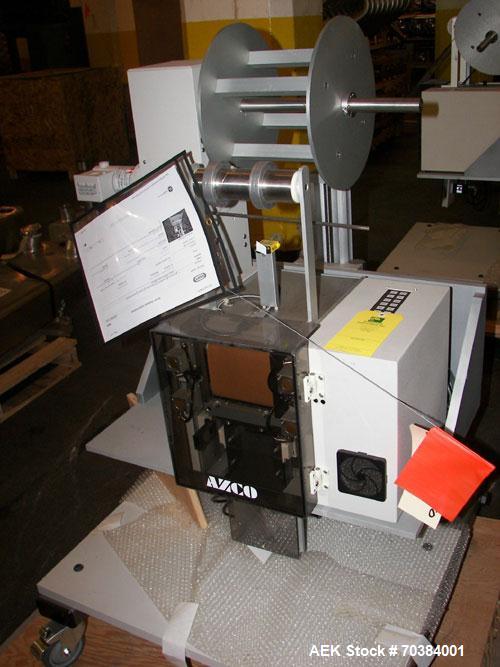 Used Azco SP 3D Dispenser. This dispenser handles pouches up to 3.5 inches wide and 3/8 inch thick at speeds up to 120 cuts per minute. It incorporates a guillotine cutter and uses compressed air to ...