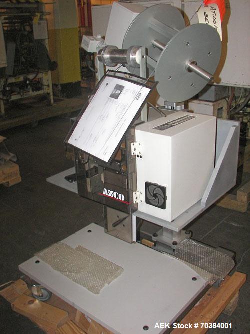 Used Azco SP 3D Dispenser. This dispenser handles pouches up to 3.5 inches wide and 3/8 inch thick at speeds up to 120 cuts per minute. It incorporates a guillotine cutter and uses compressed air to ...