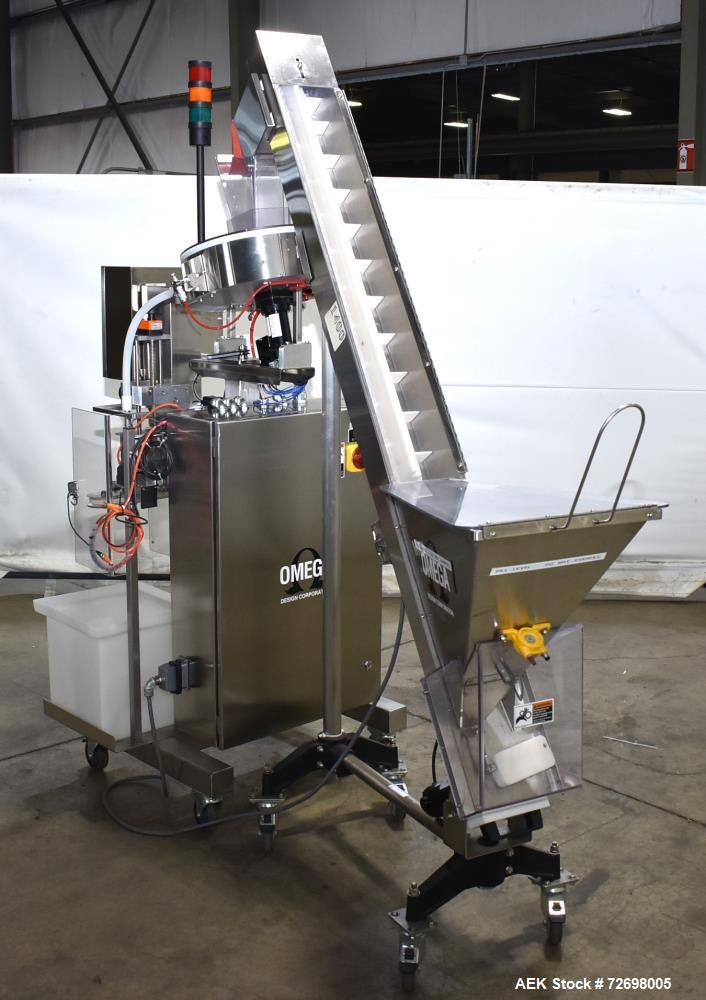 Used Omega Design Model CDFS-1.501 Canister Desiccant Feeder With Shuttle Dispenser. Machine is capable of speeds up to 400 bottles per minute (single-drop) and 300 bottles per minute (double-drop). ...