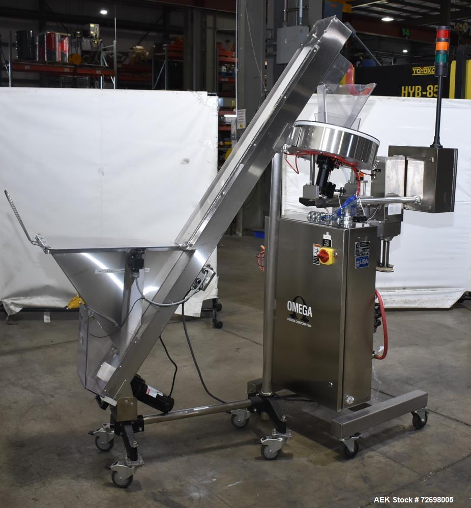 Used Omega Design Model CDFS-1.501 Canister Desiccant Feeder With Shuttle Dispenser. Machine is capable of speeds up to 400 bottles per minute (single-drop) and 300 bottles per minute (double-drop). ...