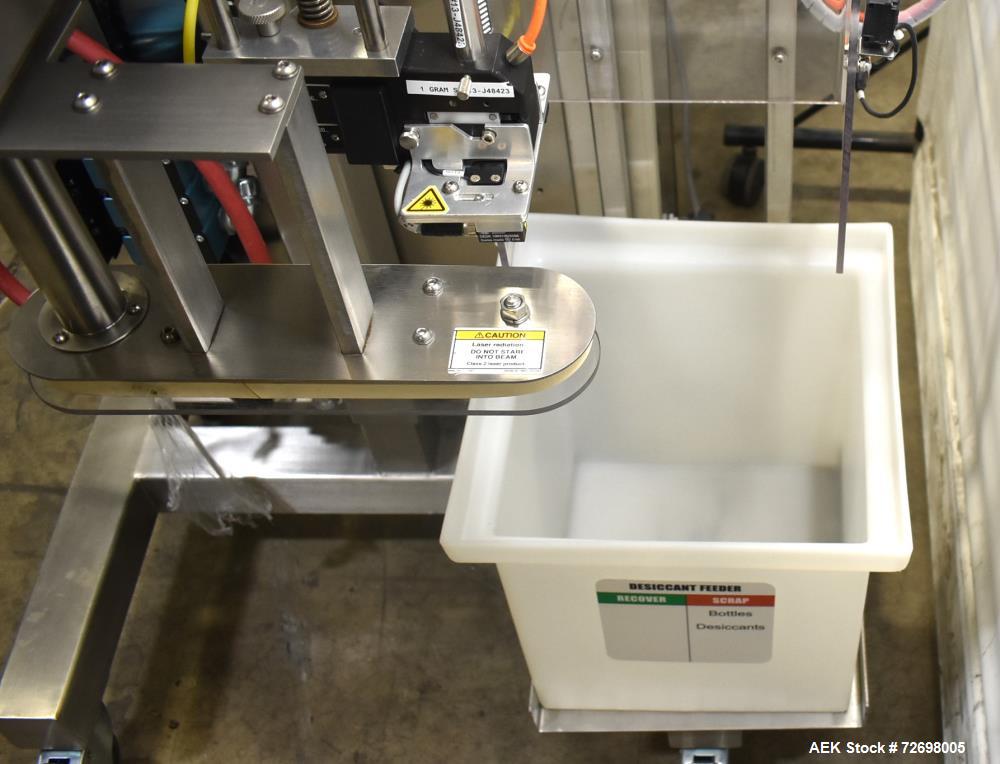 Used Omega Design Model CDFS-1.501 Canister Desiccant Feeder With Shuttle Dispenser. Machine is capable of speeds up to 400 bottles per minute (single-drop) and 300 bottles per minute (double-drop). ...