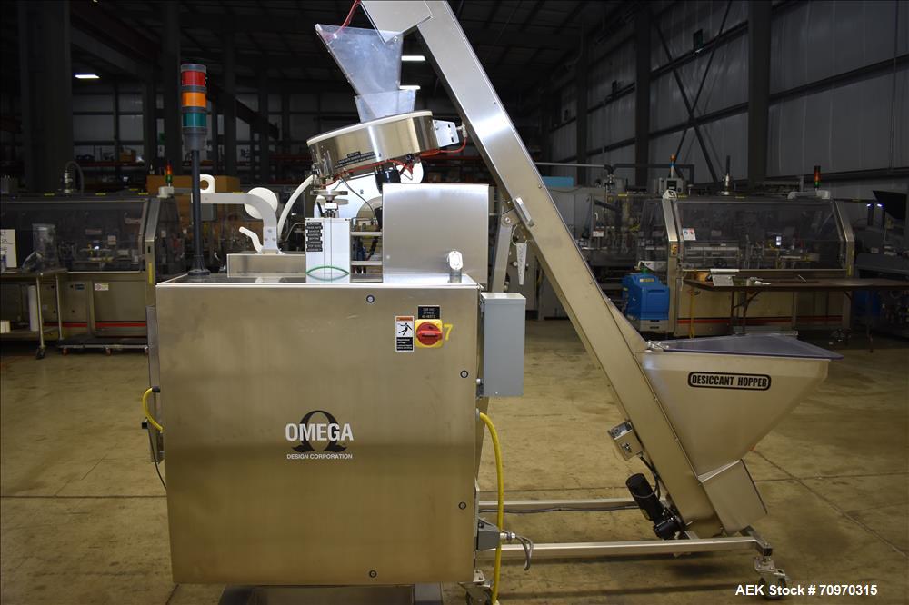 Used Omega Design Omni Feeder Combination Canister Desiccant Feeder. Capable of speeds up to 600 CPM (Single Drop) or 300 CPM (Double Drop). Servo operation, Allen Bradley PLC with integrated touch s...