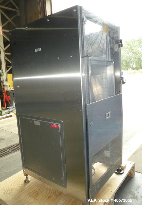 Used Palace Canister Desiccant Feeder, model P-DF. Capable of speeds up to 280 CPM on a single insertion. AB PLC controls. Integrated desiccant elevator feeder.