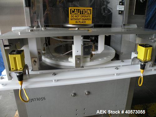 Used Palace Canister Desiccant Feeder, model P-DF. Capable of speeds up to 280 CPM on a single insertion. AB PLC controls. Integrated desiccant elevator feeder.