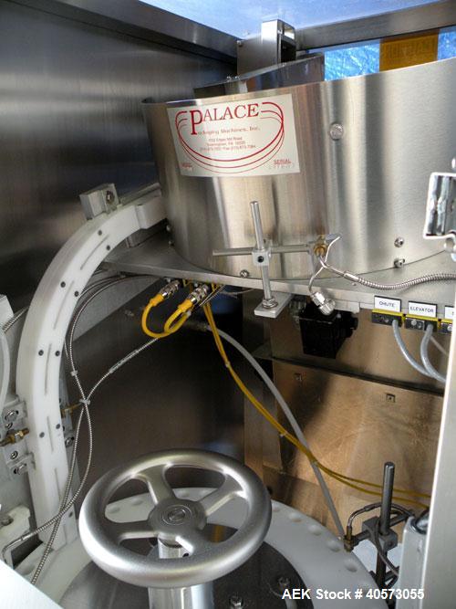 Used Palace Canister Desiccant Feeder, model P-DF. Capable of speeds up to 280 CPM on a single insertion. AB PLC controls. Integrated desiccant elevator feeder.