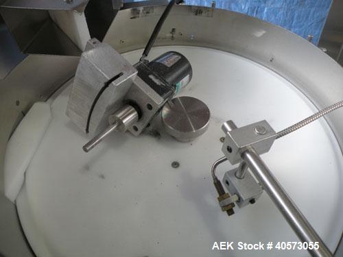 Used Palace Canister Desiccant Feeder, model P-DF. Capable of speeds up to 280 CPM on a single insertion. AB PLC controls. Integrated desiccant elevator feeder.