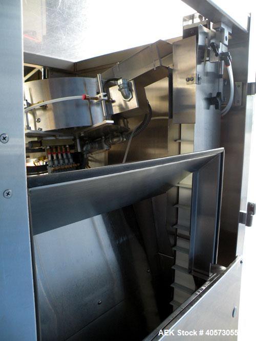 Used Palace Canister Desiccant Feeder, model P-DF. Capable of speeds up to 280 CPM on a single insertion. AB PLC controls. Integrated desiccant elevator feeder.