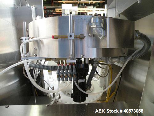 Used Palace Canister Desiccant Feeder, model P-DF. Capable of speeds up to 280 CPM on a single insertion. AB PLC controls. Integrated desiccant elevator feeder.