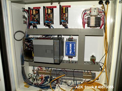 Used Palace Canister Desiccant Feeder, model P-DF. Capable of speeds up to 280 CPM on a single insertion. AB PLC controls. Integrated desiccant elevator feeder.