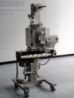 Used AZCO model SP-110 Sur-Pak Desiccant pouch dispenser. Rated speeds up to 200 cuts/minute, depending on size of pouch. Designed for pre-made pouches with a size range:  up to 4