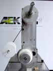 Used AZCO model SP-110 Sur-Pak Desiccant pouch dispenser. Rated speeds up to 200 cuts/minute, depending on size of pouch. Designed for pre-made pouches with a size range:  up to 4