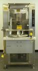 Used Palace Canister Desiccant Feeder, model P-DF. Capable of speeds up to 280 CPM on a single insertion. AB PLC controls. Integrated desiccant elevator feeder.