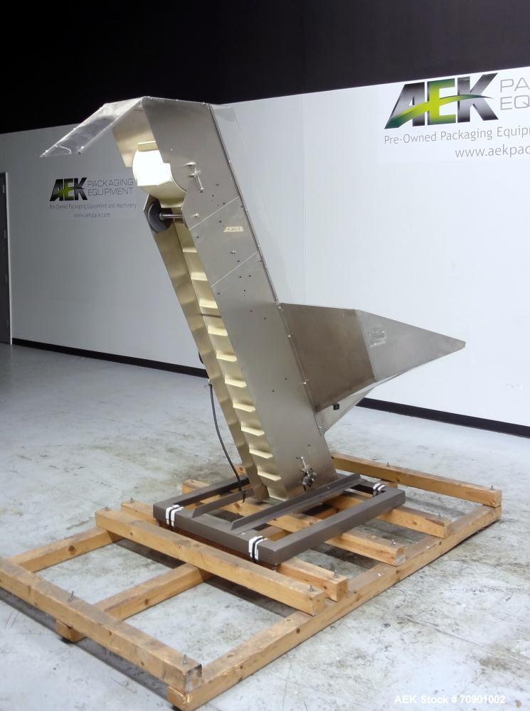 Used Incline Cleated Belt Conveyor, 304 Stainless Steel. 10-3/4" Wide X 75" long belt, with 2" tall cleats spaced approximate 6" apart. Hopper is 51" long x 44" wide x 34" deep. Unit driven by a 1/4 ...