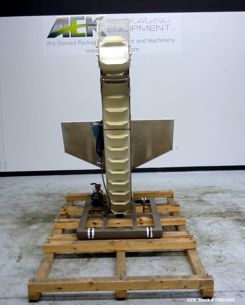 Used Incline Cleated Belt Conveyor, 304 Stainless Steel. 10-3/4" Wide X 75" long belt, with 2" tall cleats spaced approximate 6" apart. Hopper is 51" long x 44" wide x 34" deep. Unit driven by a 1/4 ...
