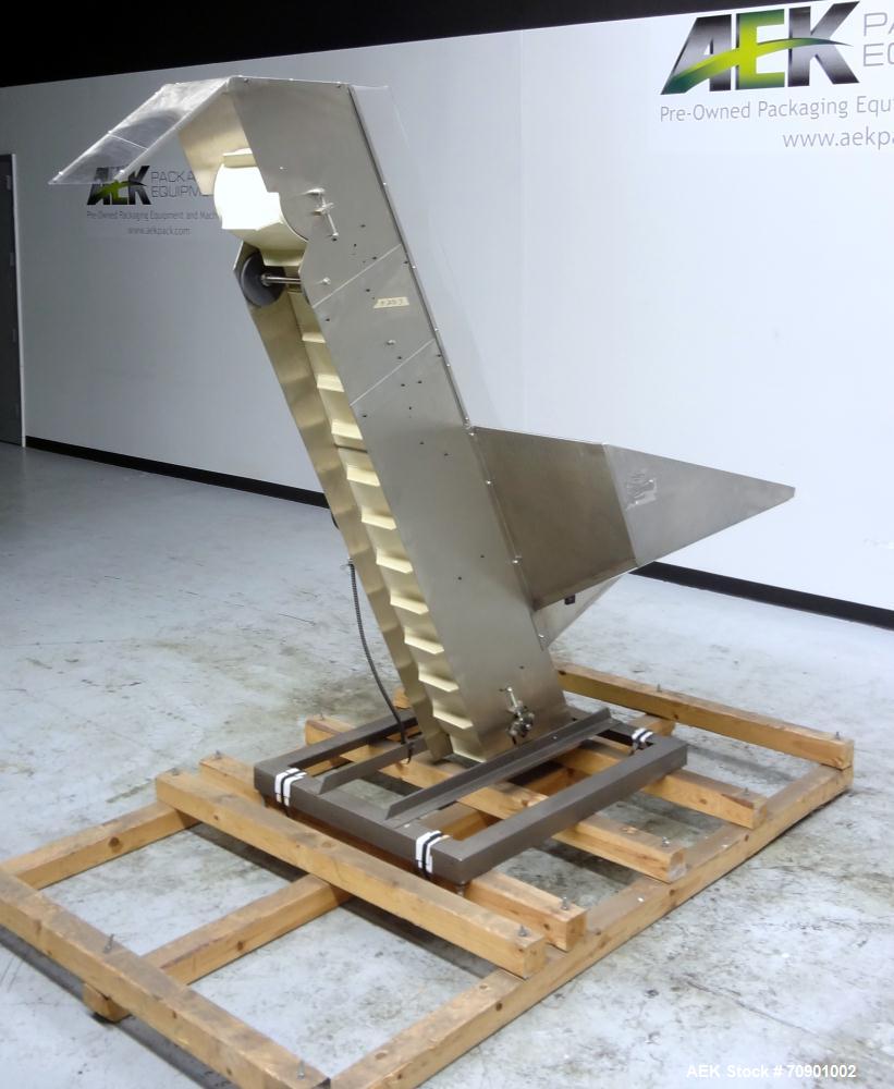 Used Incline Cleated Belt Conveyor, 304 Stainless Steel. 10-3/4" Wide X 75" long belt, with 2" tall cleats spaced approximate 6" apart. Hopper is 51" long x 44" wide x 34" deep. Unit driven by a 1/4 ...