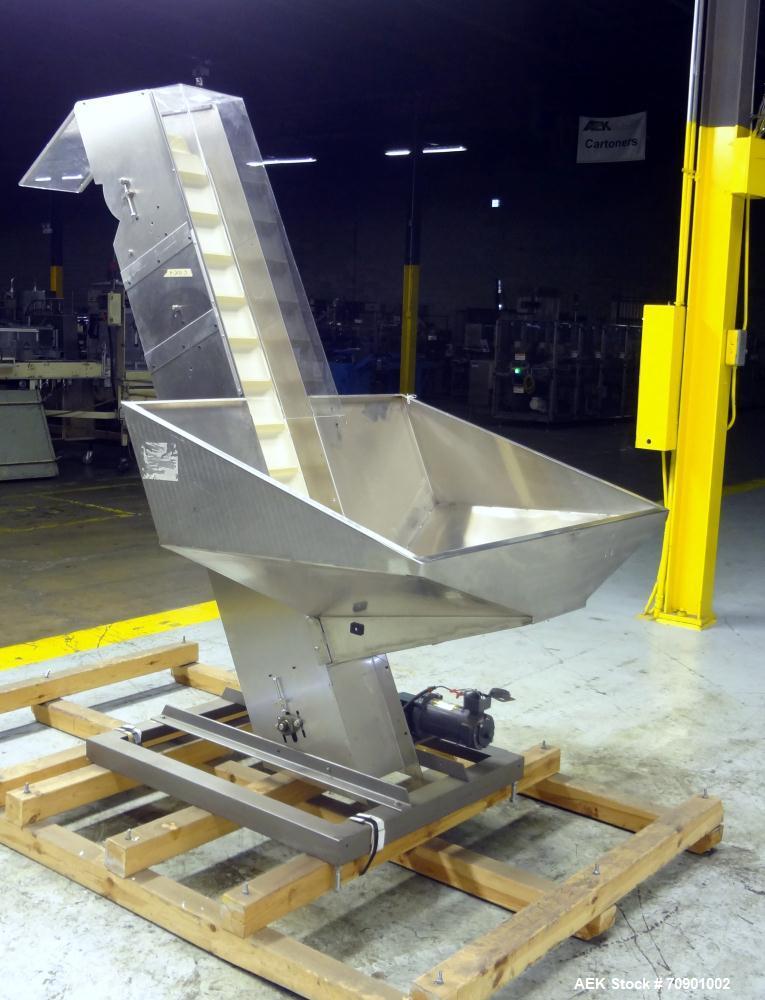Used Incline Cleated Belt Conveyor, 304 Stainless Steel. 10-3/4" Wide X 75" long belt, with 2" tall cleats spaced approximate 6" apart. Hopper is 51" long x 44" wide x 34" deep. Unit driven by a 1/4 ...