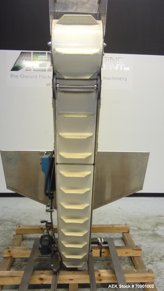 Used Incline Cleated Belt Conveyor, 304 Stainless Steel. 10-3/4" Wide X 75" long belt, with 2" tall cleats spaced approximate 6" apart. Hopper is 51" long x 44" wide x 34" deep. Unit driven by a 1/4 ...