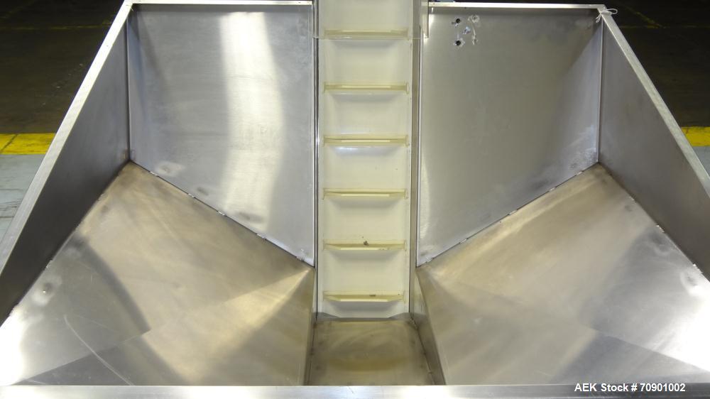 Used Incline Cleated Belt Conveyor, 304 Stainless Steel. 10-3/4" Wide X 75" long belt, with 2" tall cleats spaced approximate 6" apart. Hopper is 51" long x 44" wide x 34" deep. Unit driven by a 1/4 ...