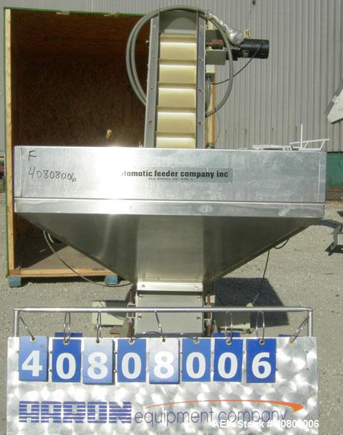 Used Hoppmann Elevating Prefeeder, model EP, Series 8, 304 stainless steel. 8" wide rubber belt with 2" pleats placed approximately 6" apart. Approximate 48" discharge height. 43 1/2" x 42" x 27" dee...