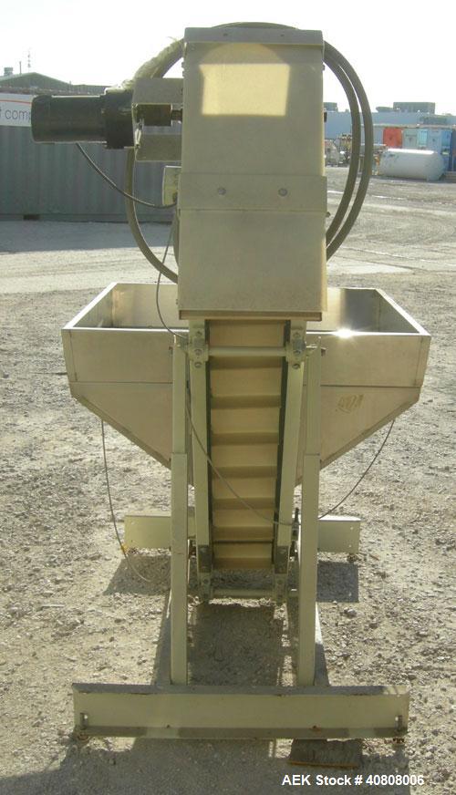 Used Hoppmann Elevating Prefeeder, model EP, Series 8, 304 stainless steel. 8" wide rubber belt with 2" pleats placed approximately 6" apart. Approximate 48" discharge height. 43 1/2" x 42" x 27" dee...