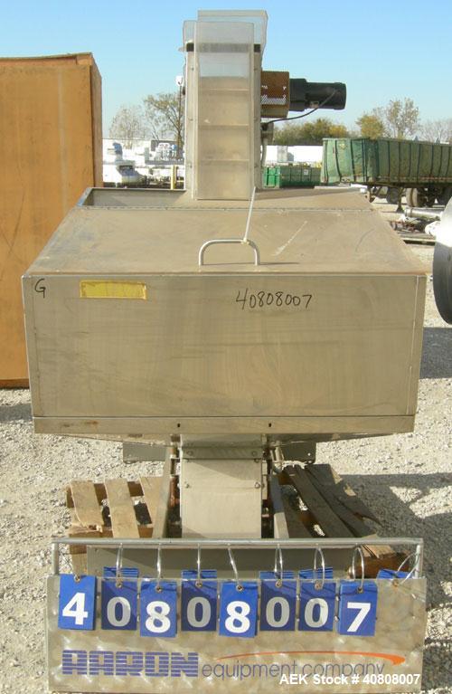 Used Hoppmann Elevating Prefeeder, model EP, Series 8, 304 stainless steel. 8" wide rubber belt with 2" pleats placed approximately 6" apart. Approximate 56" discharge height. 42" x 48" x 32" deep ho...