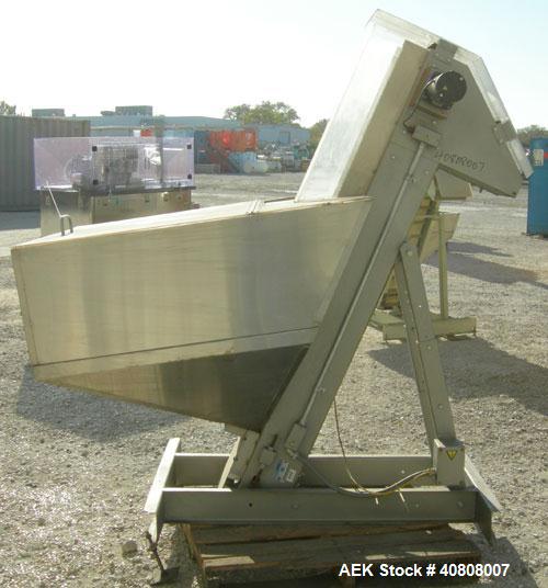 Used Hoppmann Elevating Prefeeder, model EP, Series 8, 304 stainless steel. 8" wide rubber belt with 2" pleats placed approximately 6" apart. Approximate 56" discharge height. 42" x 48" x 32" deep ho...