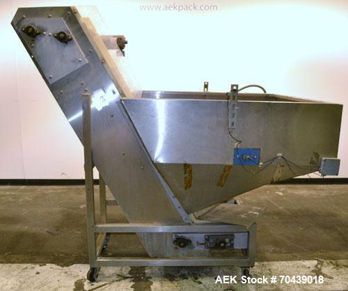 Used- Stainless Steel New England Machinery Cap / Bottle  Elevator, Model H/E-60