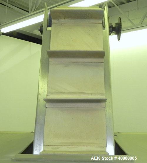 Used Cap Conveyor/Elevator, 304 Stainless Steel. 10" Wide rubber belt with 3" pleats placed approximately 8" apart. Approximate 86" discharge height. 44" x 44" x 35" deep hopper with bolt on plastic ...