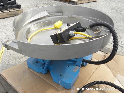 Used FMC Magnetic Parts Feeder, Model EB142. 22" Diameter stainless steel bowl.  Mounted on a carbon steel base.