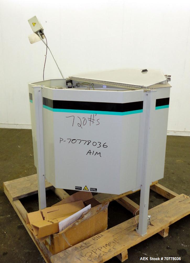 Used Hoppman 12 cuft prefeeder with Hoppman vibratory bowl feeder. Includes Hoppman FS 30 bowl feeder with scallops.