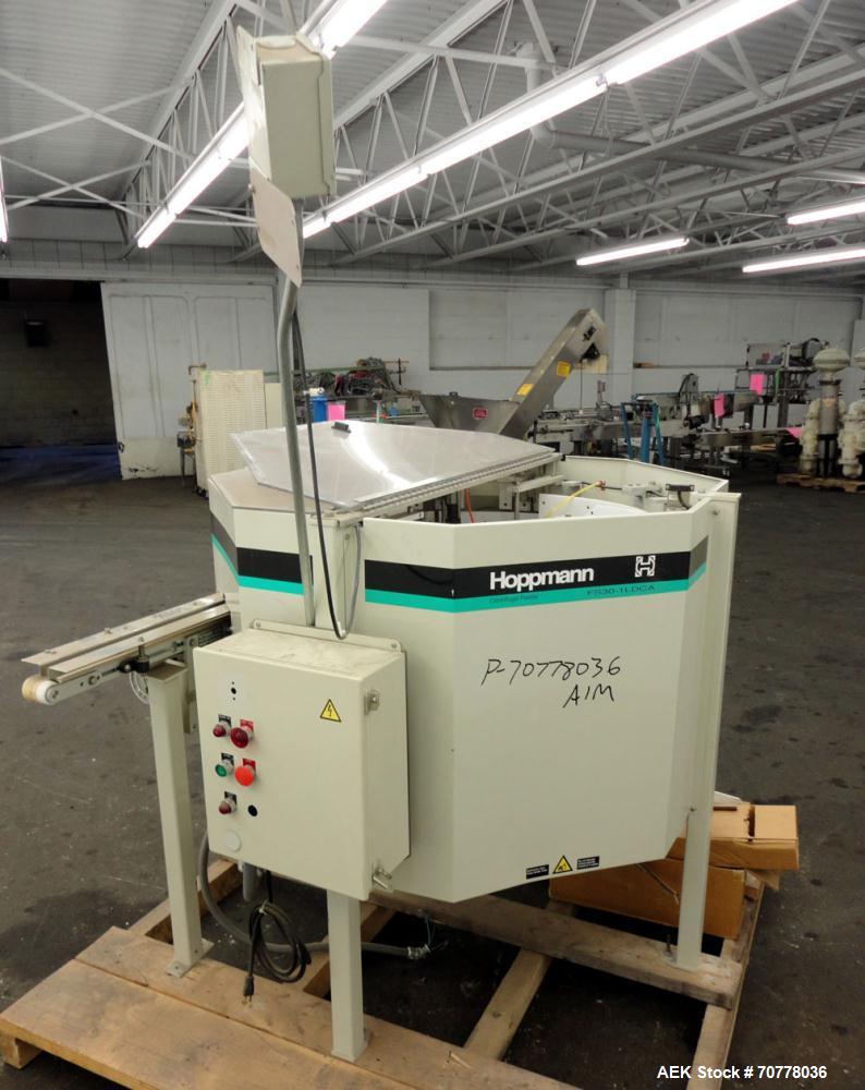 Used Hoppman 12 cuft prefeeder with Hoppman vibratory bowl feeder. Includes Hoppman FS 30 bowl feeder with scallops.