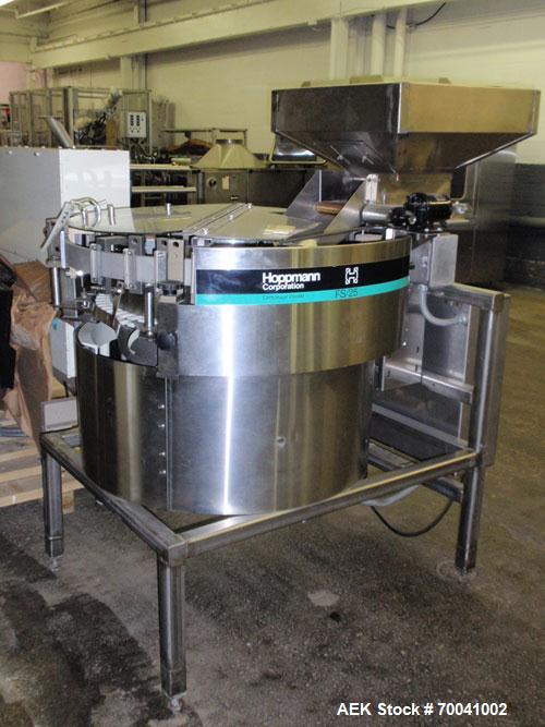 Used Hoppmann Corporation Centrifugal Bowl Feeder, Model FS/25, Stainless Steel. Includes a Hoppmann live bottom prefeeder, model LB-03. Approximate rating up to 325 vials per minute. Mounted on a st...