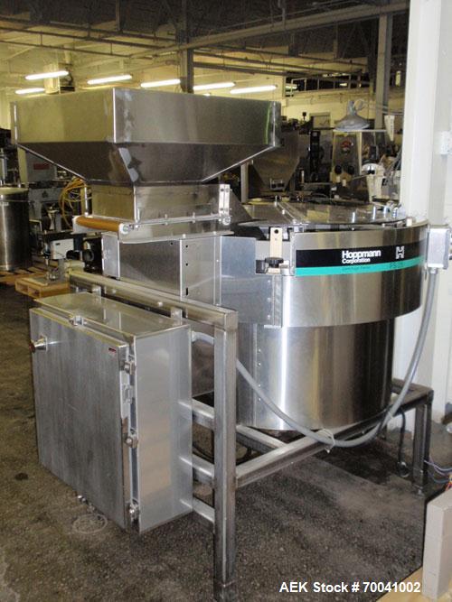 Used Hoppmann Corporation Centrifugal Bowl Feeder, Model FS/25, Stainless Steel. Includes a Hoppmann live bottom prefeeder, model LB-03. Approximate rating up to 325 vials per minute. Mounted on a st...
