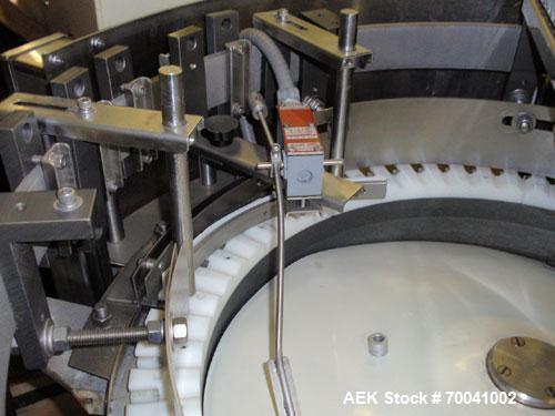 Used Hoppmann Corporation Centrifugal Bowl Feeder, Model FS/25, Stainless Steel. Includes a Hoppmann live bottom prefeeder, model LB-03. Approximate rating up to 325 vials per minute. Mounted on a st...