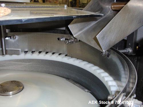 Used Hoppmann Corporation Centrifugal Bowl Feeder, Model FS/25, Stainless Steel. Includes a Hoppmann live bottom prefeeder, model LB-03. Approximate rating up to 325 vials per minute. Mounted on a st...