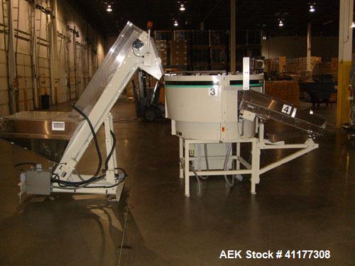 Used Hoppmann Corporation Centrifugal Bowl Feeder, Model FT40-CRS. Rated 1000 parts per minute. Includes a control panel and a Hoppmann Elevating Prefeeder, Model EP-15. Prefeeder serial# 31431.