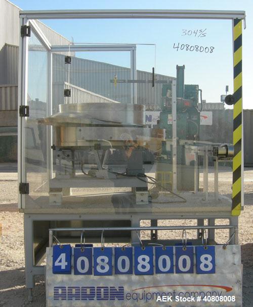 Used Vibratory Parts Feeder, 304 stainless steel. 20'' diameter x 9'' deep feed pan. Mounted on a 23'' tall table.