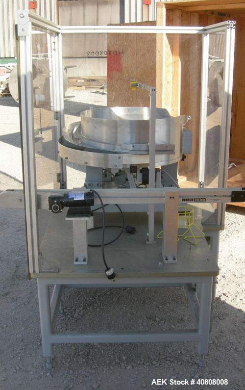 Used Vibratory Parts Feeder, 304 stainless steel. 20'' diameter x 9'' deep feed pan. Mounted on a 23'' tall table.