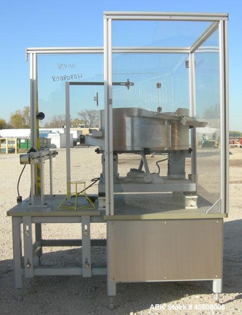 Used Vibratory Parts Feeder, 304 stainless steel. 20'' diameter x 9'' deep feed pan. Mounted on a 23'' tall table.
