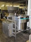 Used Hoppmann Corporation Centrifugal Bowl Feeder, Model FS/25, Stainless Steel. Includes a Hoppmann live bottom prefeeder, model LB-03. Approximate rating up to 325 vials per minute. Mounted on a st...