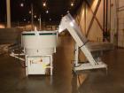 Used Hoppmann Corporation Centrifugal Bowl Feeder, Model FT40-CRS. Rated 1000 parts per minute. Includes a control panel and a Hoppmann Elevating Prefeeder, Model EP-15. Prefeeder serial# 31431.