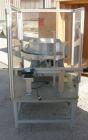 Used Vibratory Parts Feeder, 304 stainless steel. 20'' diameter x 9'' deep feed pan. Mounted on a 23'' tall table.