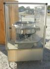 Used Vibratory Parts Feeder, 304 stainless steel. 20'' diameter x 9'' deep feed pan. Mounted on a 23'' tall table.