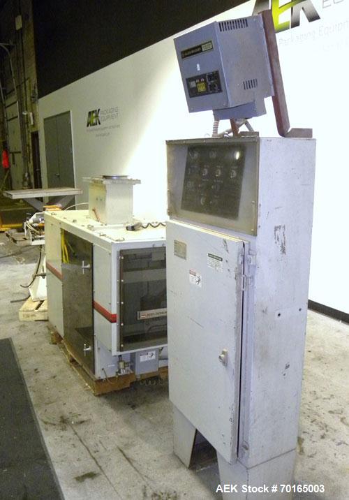 Used Bemis Bulk Bag Weigh Scale Filler, Model 6134E95, carbon steel. Includes bag clamp and panel. Approximate capacity of filling up to 50 pound bags.
