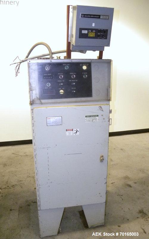 Used Bemis Bulk Bag Weigh Scale Filler, Model 6134E95, carbon steel. Includes bag clamp and panel. Approximate capacity of filling up to 50 pound bags.