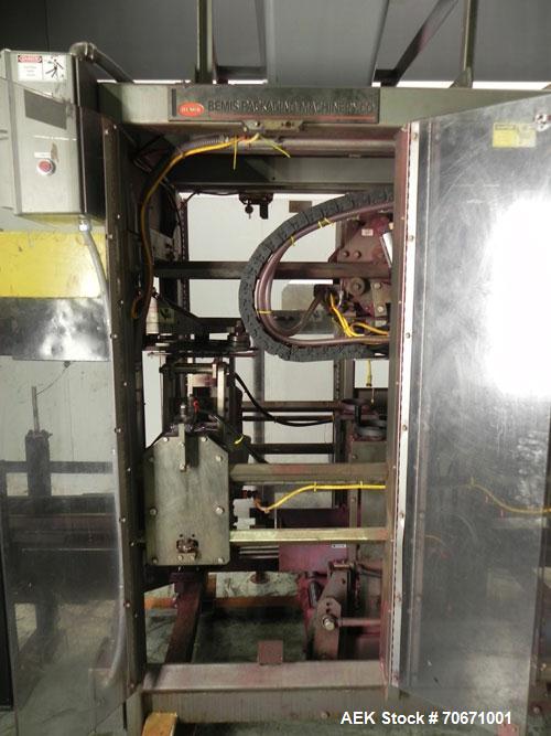 Used- Bemis Model 7115E168 Bag Filler with Model 6162A2 Duplex Net Weigh Scale & automated Bemis bag placer with blank bag m...